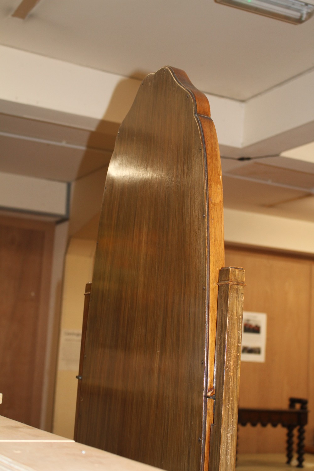A walnut cheval mirror and a satin maple coffee table, L.150cm D.81cm H.41cm